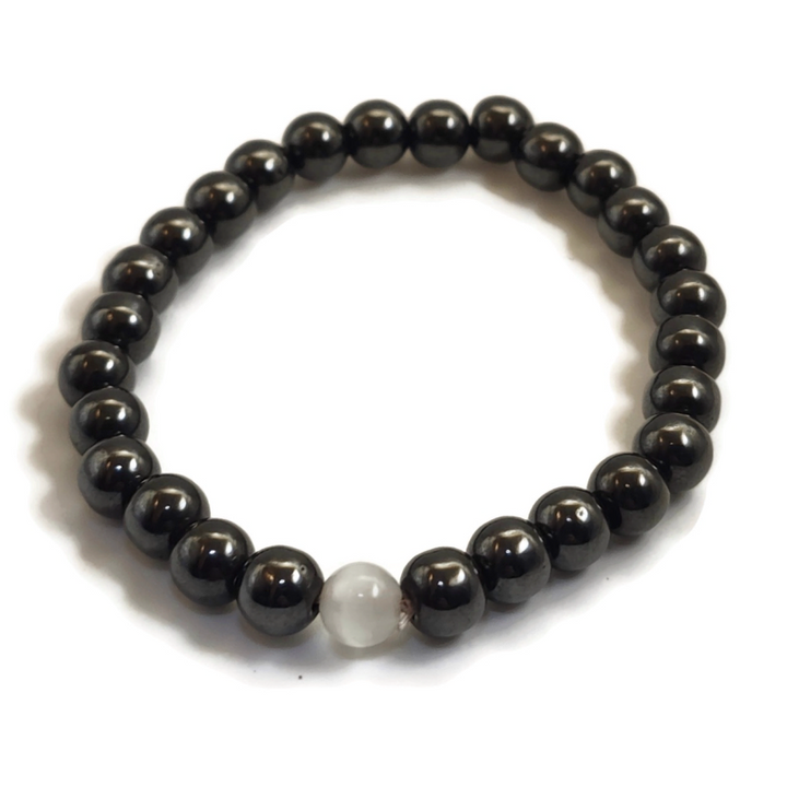 Magnetic bracelet with a white gemstone.
