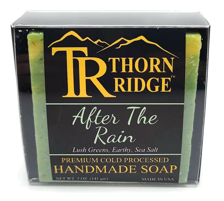 Packaging of Thorn Ridge soap labeled "After the Rain," described as lush greens, earthy, sea salt, premium cold processed, handmade, 5 oz. Made in USA.