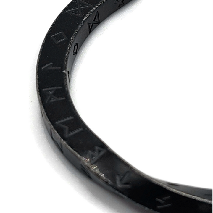 Black rune twist bracelet with engraved rune symbols. Stainless steel.
