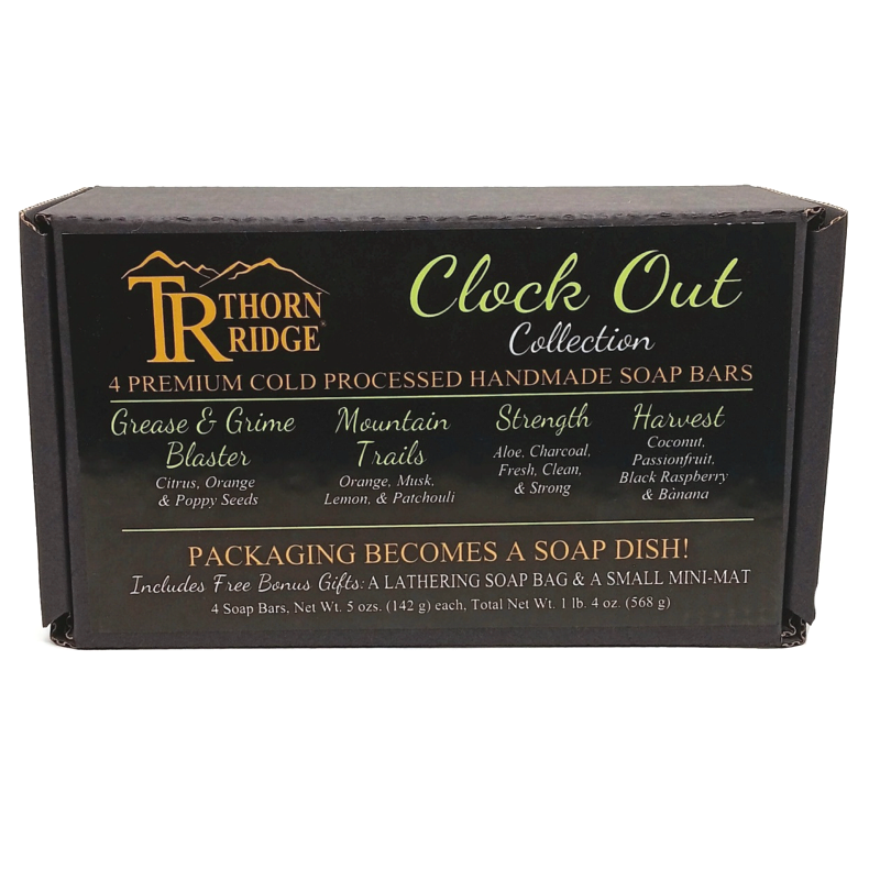 Packaging of Thorn Ridge soap gift set labeled "Clock Out Collection," described as containing 4 individually packaged soaps, lathering soap bag, extra mini mat, premium cold processed, handmade, 5 oz each (1 lb 4 oz), Made in USA.