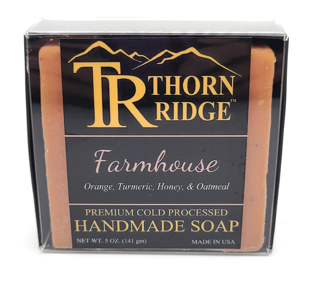 Packaging of Thorn Ridge soap labeled "Farmhouse," described as orange, tumeric, honey, oatmeal, premium cold processed, handmade, 5 oz. Made in USA.