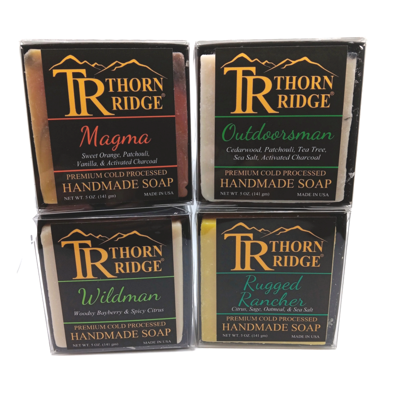 Packaging of Thorn Ridge soap gift set labeled "The Frontier Collection," described as containing 4 individually packaged soaps, lathering soap bag, extra mini mats, premium cold processed, handmade, 5 oz each (1 lb 4 oz), Made in USA.