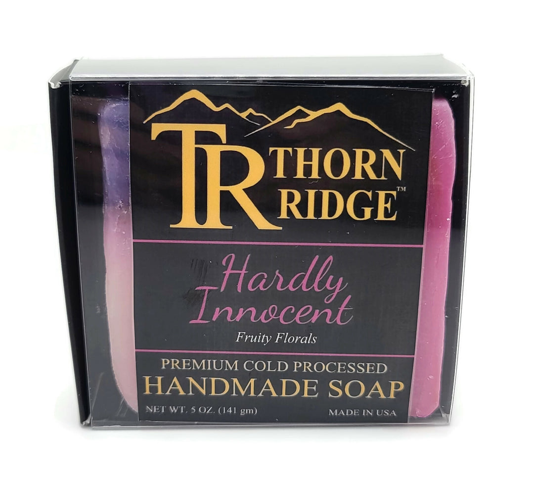 Packaging of Thorn Ridge soap labeled "Hardly Innocent," described as fruity florals, premium cold processed, handmade, 5 oz. Made in USA.