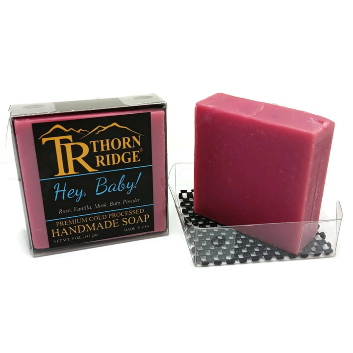 Packaging of Thorn Ridge soap labeled "Hey Baby!," described as rose, vanilla, musk, baby powder, premium cold processed, handmade, 5 oz. Made in USA.