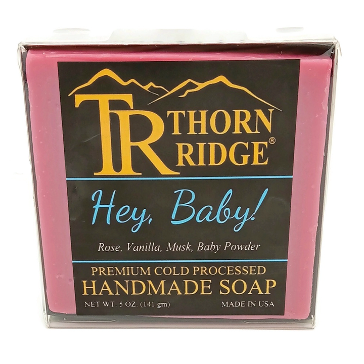 Packaging of Thorn Ridge soap labeled "Hey Baby!," described as rose, vanilla, musk, baby powder, premium cold processed, handmade, 5 oz. Made in USA.