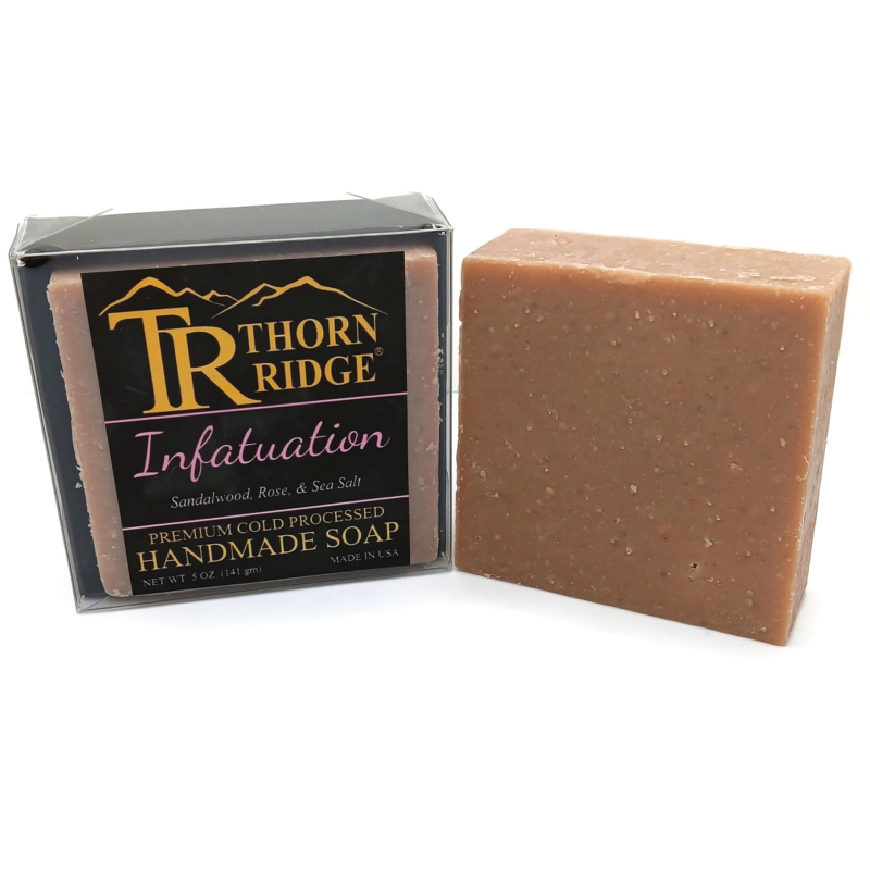 Packaging of Thorn Ridge soap labeled "Infatuation," described as sandalwood, rose, sea salt, premium cold processed, handmade, 5 oz. Made in USA.