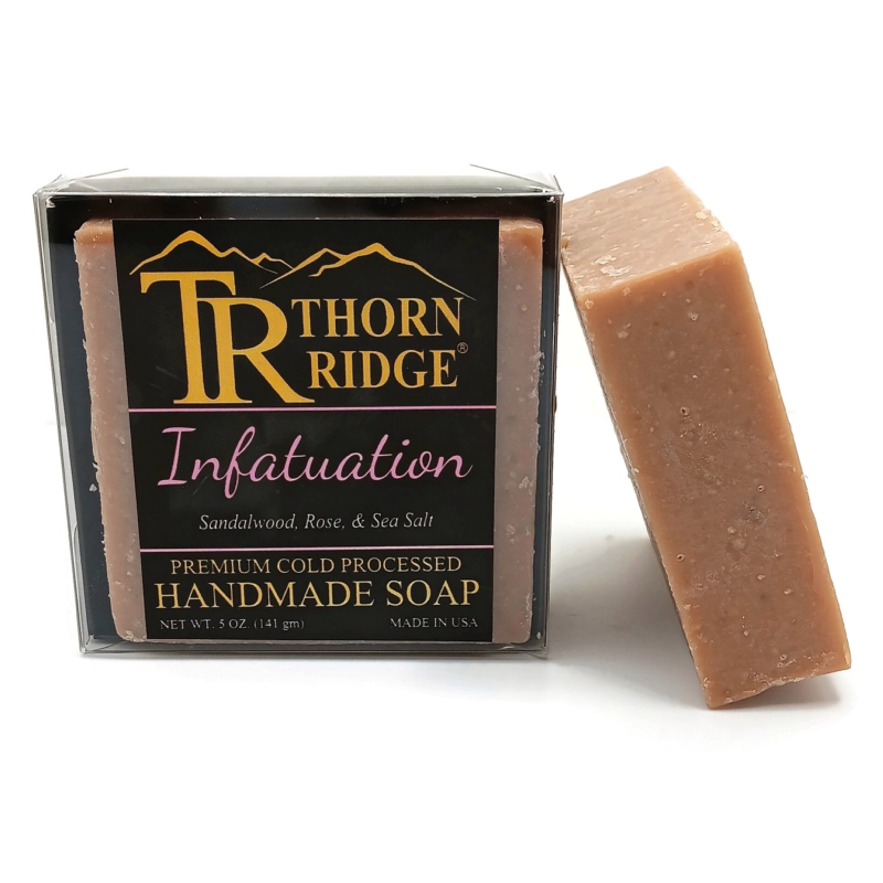 Packaging of Thorn Ridge soap labeled "Infatuation," described as sandalwood, rose, sea salt, premium cold processed, handmade, 5 oz. Made in USA.