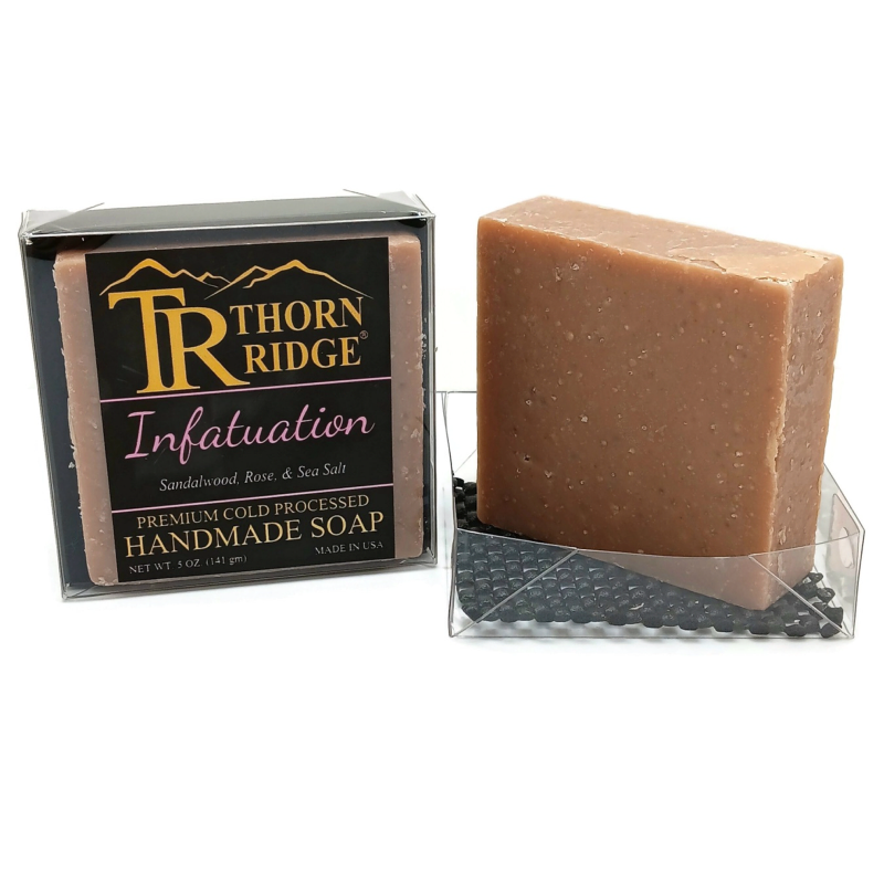 Packaging of Thorn Ridge soap labeled "Infatuation," described as sandalwood, rose, sea salt, premium cold processed, handmade, 5 oz. Made in USA.