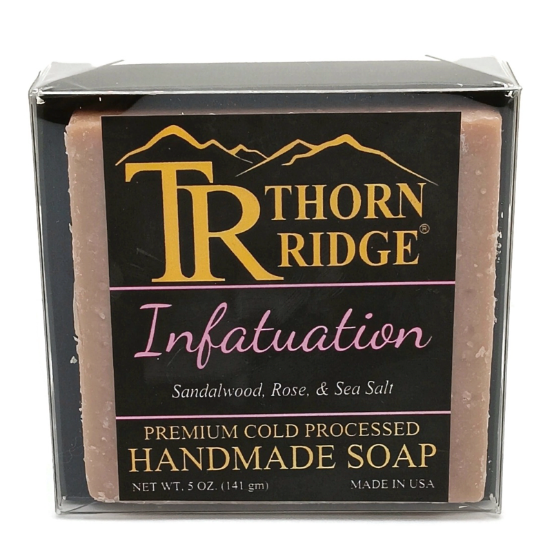 Packaging of Thorn Ridge soap labeled "Infatuation," described as sandalwood, rose, sea salt, premium cold processed, handmade, 5 oz. Made in USA.