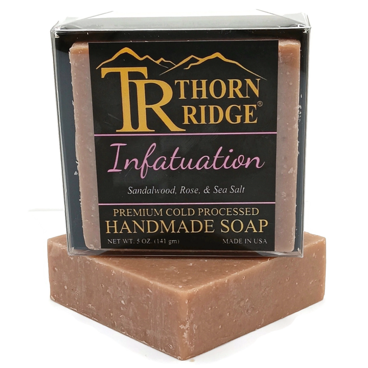 Packaging of Thorn Ridge soap labeled "Infatuation," described as sandalwood, rose, sea salt, premium cold processed, handmade, 5 oz. Made in USA.