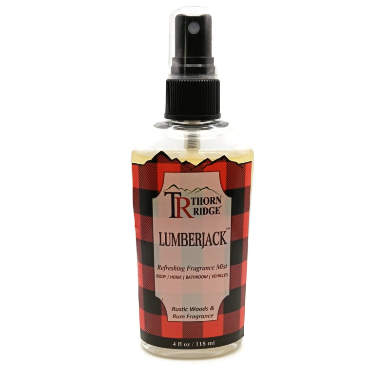 A bottle of Thorn Ridge fragrance mist labeled "Lumberjack," described as a rustic woods and rum scent for body, home, bathroom, and vehicles. 4 fl oz.