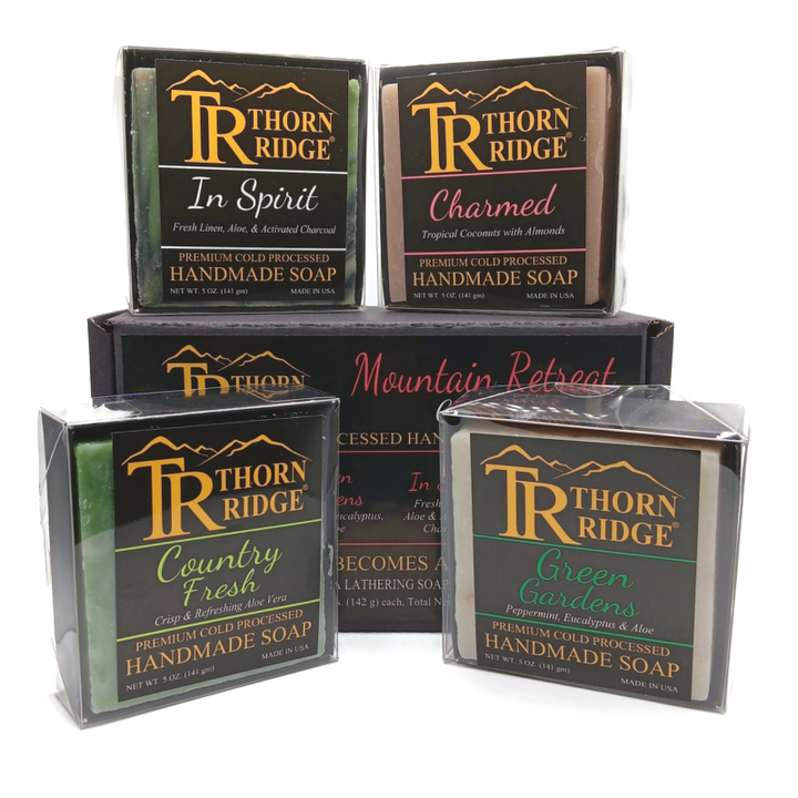 Packaging of Thorn Ridge soap gift set labeled "Mountain Retreat  Collection," described as containing 4 individually packaged soaps, lathering soap bag, extra mini mat, premium cold processed, handmade, 5 oz each (1 lb 4 oz), Made in USA.