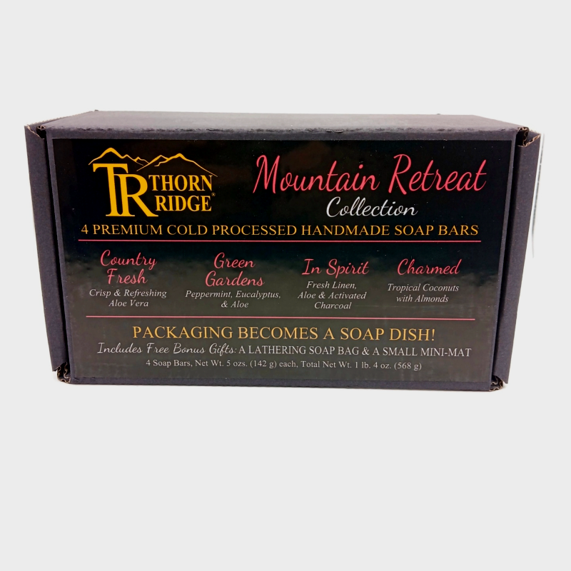 Packaging of Thorn Ridge soap gift set labeled "Mountain Retreat  Collection," described as containing 4 individually packaged soaps, lathering soap bag, extra mini mat, premium cold processed, handmade, 5 oz each (1 lb 4 oz), Made in USA.