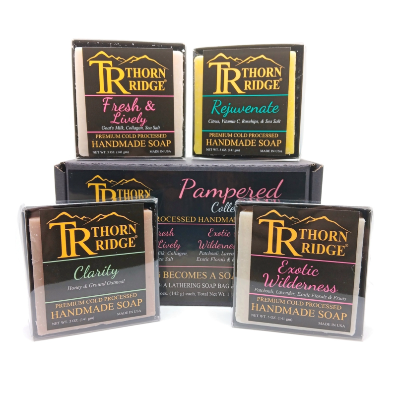 Packaging of Thorn Ridge soap gift set labeled "Pampered Collection," described as containing 4 individually packaged soaps, lathering soap bag, extra mini mat, premium cold processed, handmade, 5 oz each (1 lb 4 oz), Made in USA.