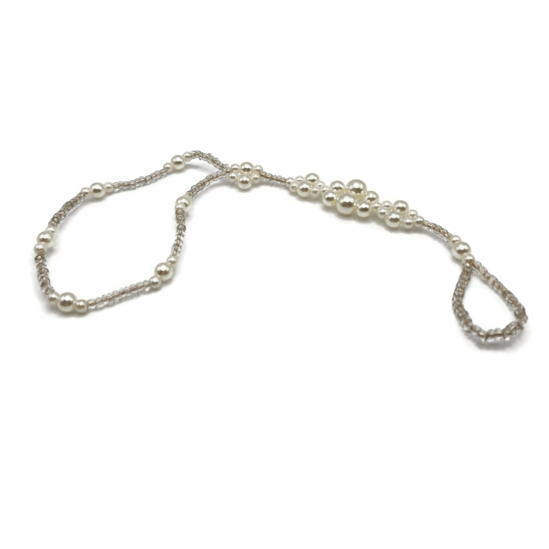 Imitation pearl anklet that connects to your toe. Can also be worn as a wristlet.