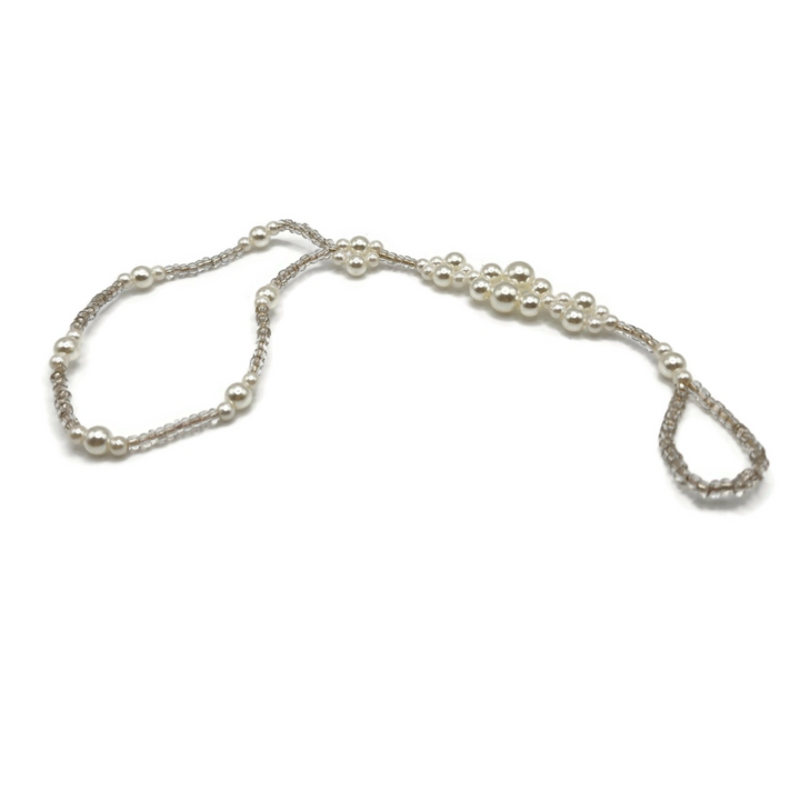 Imitation pearl anklet that connects to your toe. Can also be worn as a wristlet.