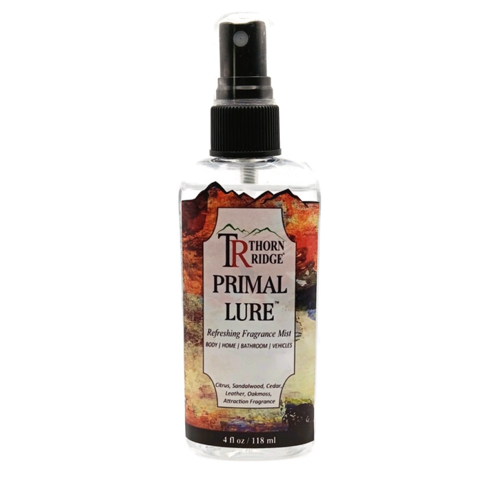 A bottle of Thorn Ridge fragrance mist labeled "Primal Lure," described as a citrus, sandalwood, cedar, leather, oakmoss, attraction scent for body, home, bathroom, and vehicles. 4 fl oz.