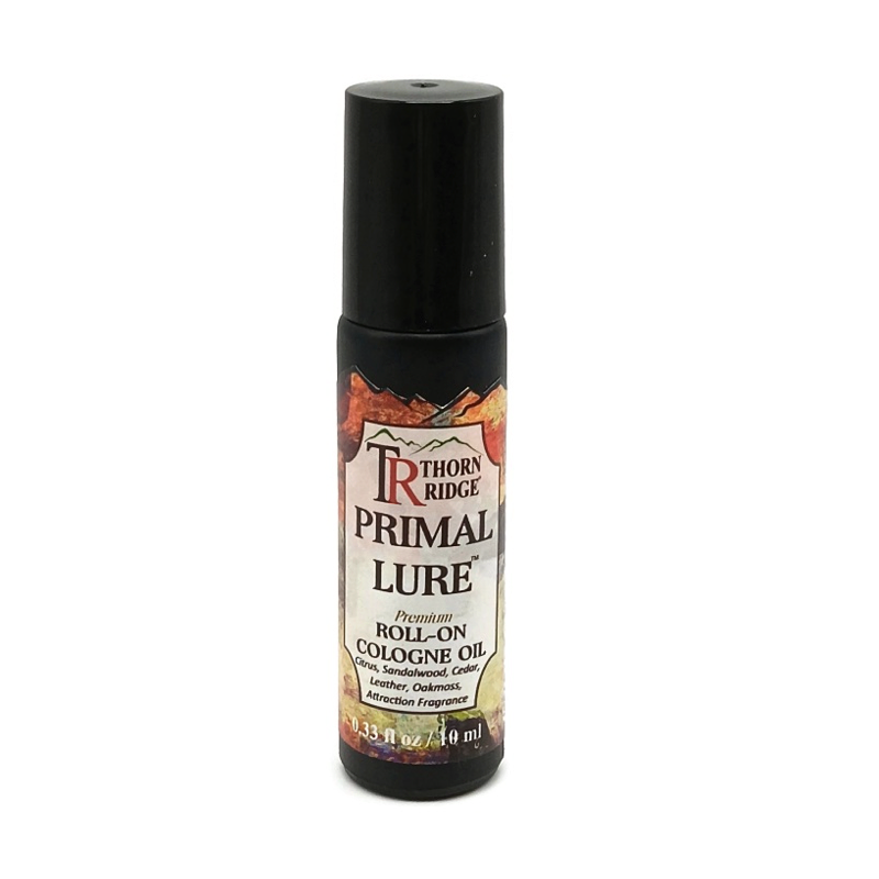 A bottle of Thorn Ridge roll on cologne labeled "Primal Lure," described as a citrus, sandalwood, cedar, leather, oakmoss, attraction fragrance. 0.33 fl oz, 10 ml.