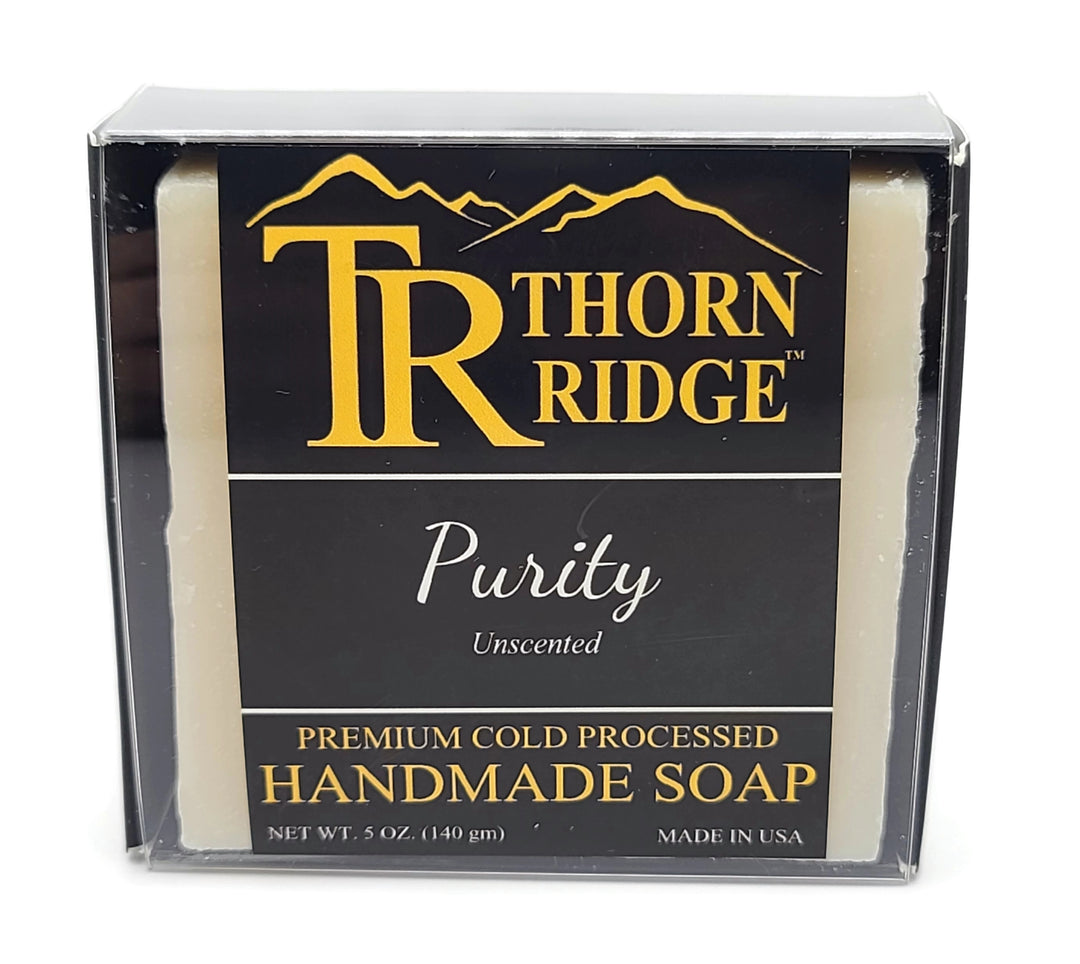 Packaging of Thorn Ridge soap labeled "Purity," described as unscented, premium cold processed, handmade, 5 oz. Made in USA.