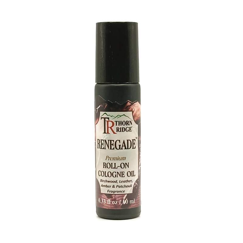 A bottle of Thorn Ridge roll on cologne labeled "Renegade," described as a birchwood, leather, amber, and patchouli fragrance. 0.33 fl oz, 10 ml.