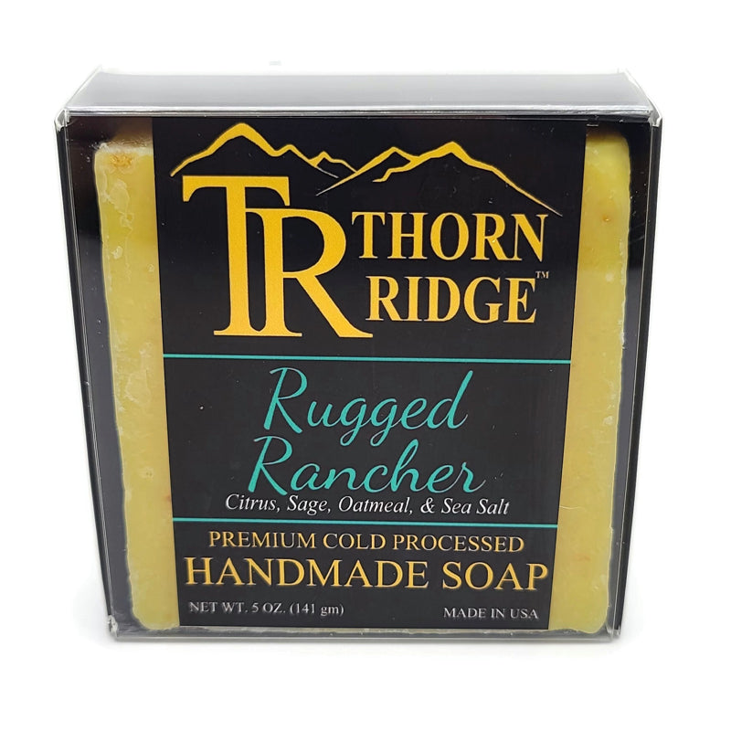 Packaging of Thorn Ridge soap labeled "Rugged Rancher," described as citrus, sage, oatmeal, sea salt, premium cold processed, handmade, 5 oz. Made in USA.