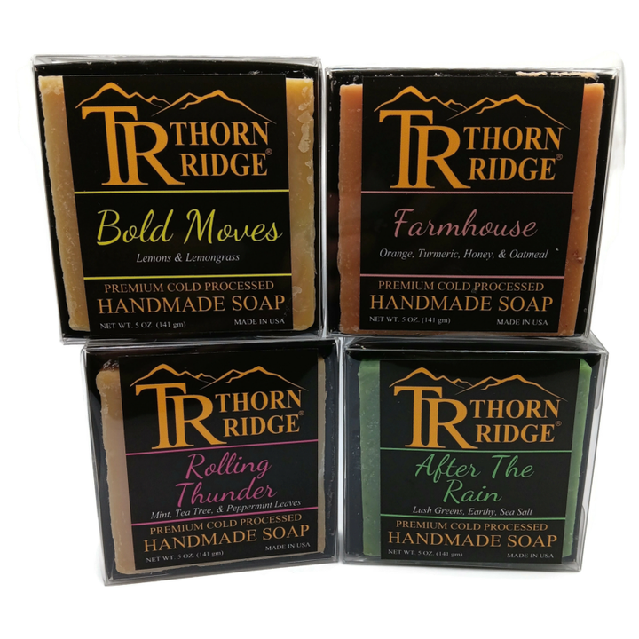 Packaging of Thorn Ridge soap gift set labeled "Summer Storm Collection," described as containing 4 individually packaged soaps, lathering soap bag, mini mat, premium cold processed, handmade, 5 oz each (1 lb 4 oz), Made in USA.