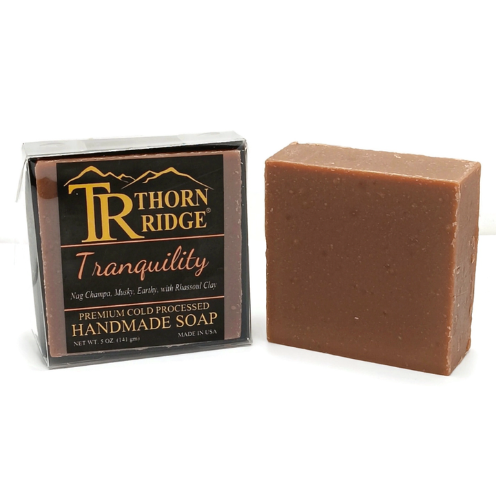 Packaging of Thorn Ridge soap labeled "Tranquility," described as nag champa, musky, earthy, with rhassoul clay, premium cold processed, handmade, 5 oz. Made in USA.