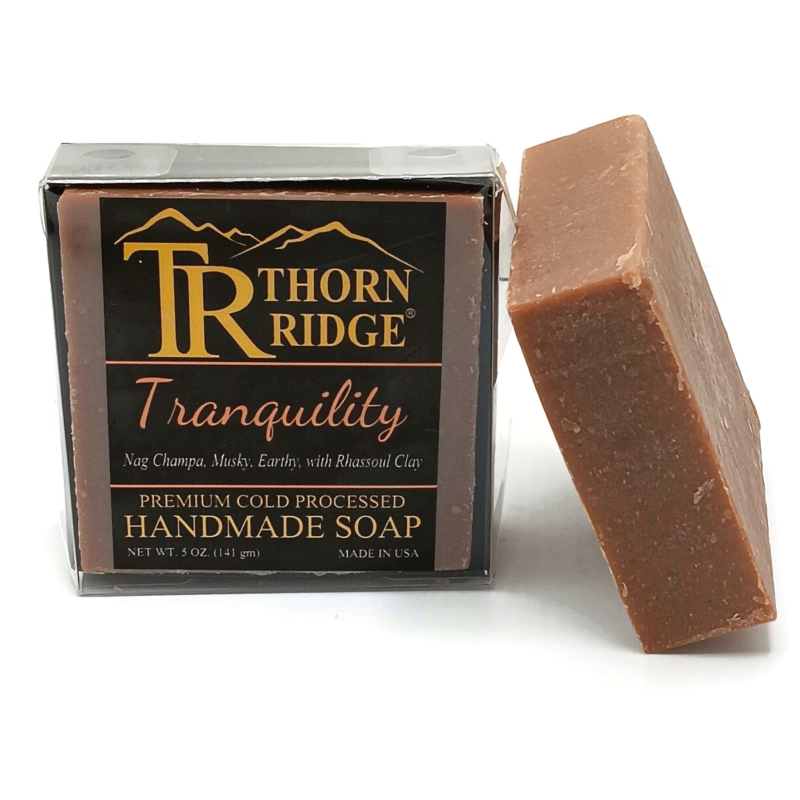 Packaging of Thorn Ridge soap labeled "Tranquility," described as nag champa, musky, earthy, with rhassoul clay, premium cold processed, handmade, 5 oz. Made in USA.