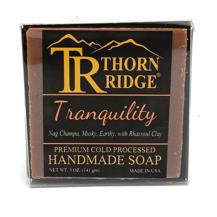 Packaging of Thorn Ridge soap labeled "Tranquility," described as nag champa, musky, earthy, with rhassoul clay, premium cold processed, handmade, 5 oz. Made in USA.