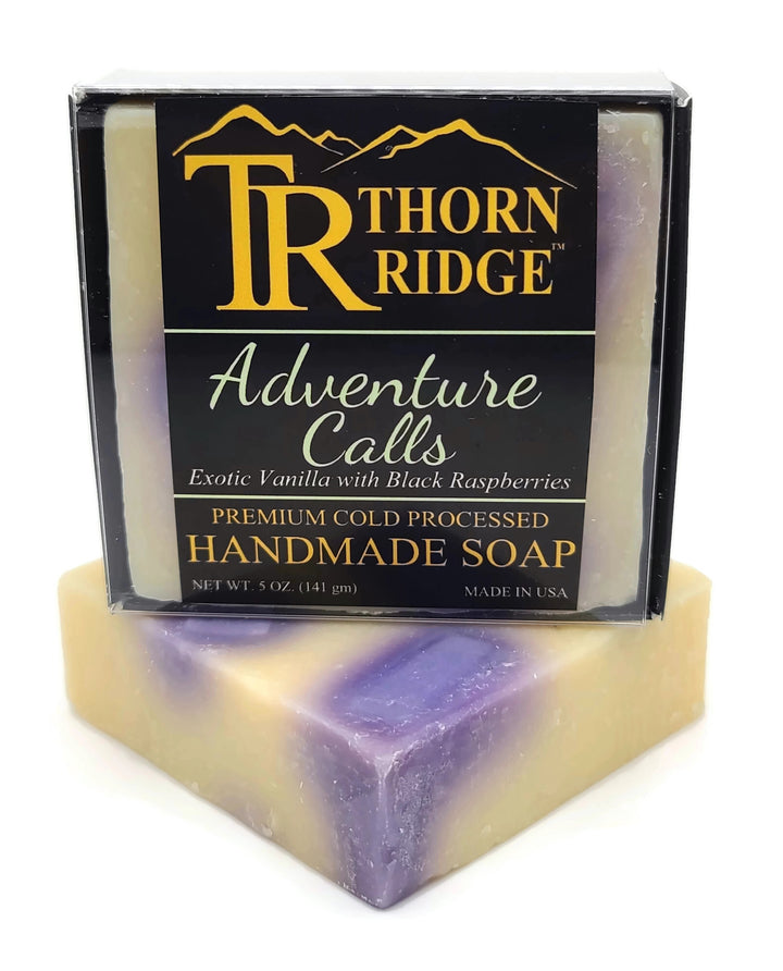 Packaging of Thorn Ridge soap labeled "Adventure Calls," described as exotic vanilla with black raspberries, premium cold processed, handmade, 5 oz. Made in USA.