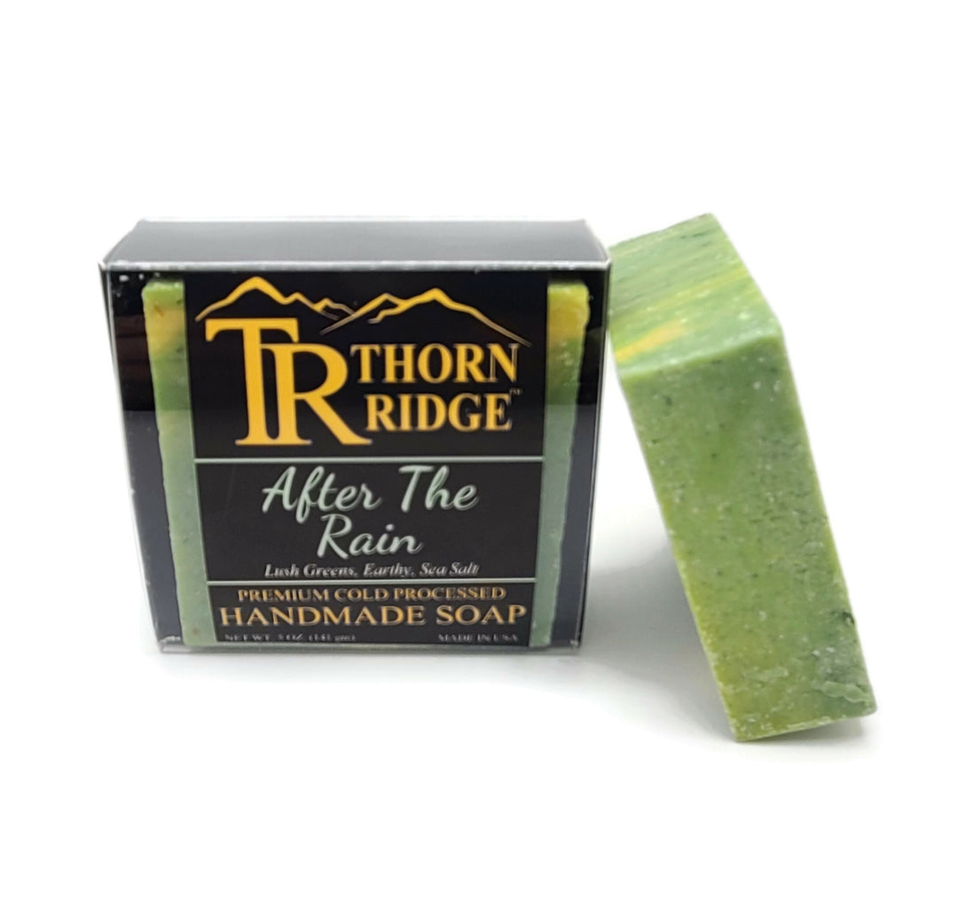 Packaging of Thorn Ridge soap labeled "After The Rain," described as lush greens, earthy, sea salt, premium cold processed, handmade, 5 oz. Made in USA.