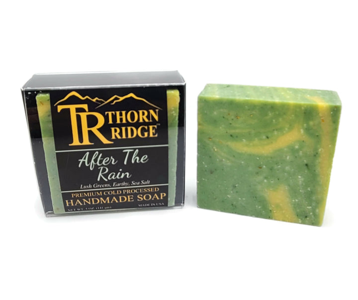 Packaging of Thorn Ridge soap labeled "After The Rain," described as lush greens, earthy, sea salt, premium cold processed, handmade, 5 oz. Made in USA.