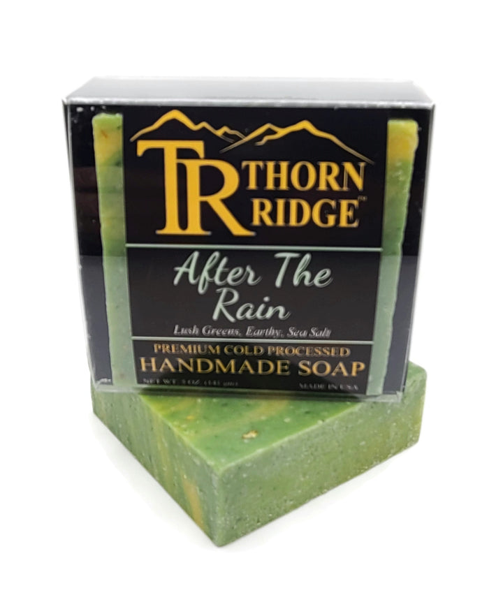 Packaging of Thorn Ridge soap labeled "After The Rain," described as lush greens, earthy, sea salt, premium cold processed, handmade, 5 oz. Made in USA.