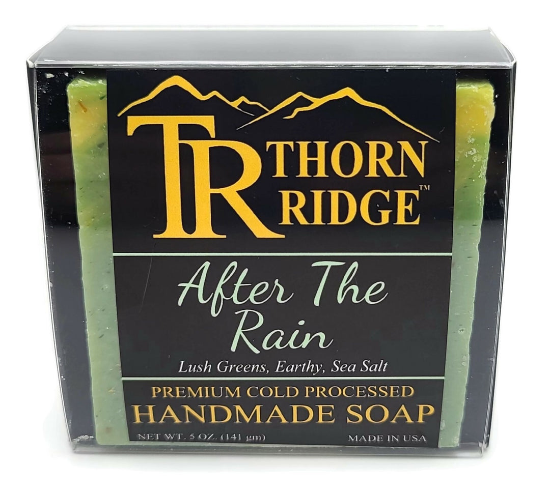 Packaging of Thorn Ridge soap labeled "After The Rain," described as lush greens, earthy, sea salt, premium cold processed, handmade, 5 oz. Made in USA.