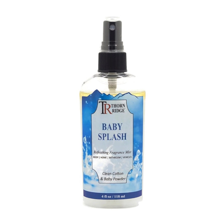 A bottle of Thorn Ridge fragrance mist labeled "Baby Splash," described as a clean cotton and baby powder scent for body, home, bathroom, and vehicles. 4 fl oz.