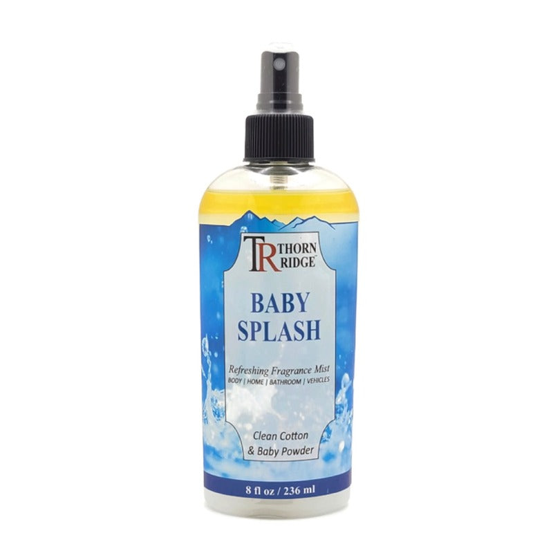 A bottle of Thorn Ridge fragrance mist labeled "Baby Splash," described as a clean cotton and baby powder scent for body, home, bathroom, and vehicles. 8 fl oz.