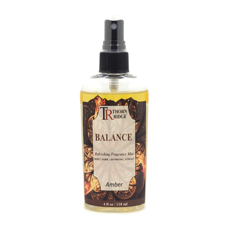 A bottle of Thorn Ridge fragrance mist labeled "Balance," described as an amber scent for body, home, bathroom, and vehicles. 4 fl oz.