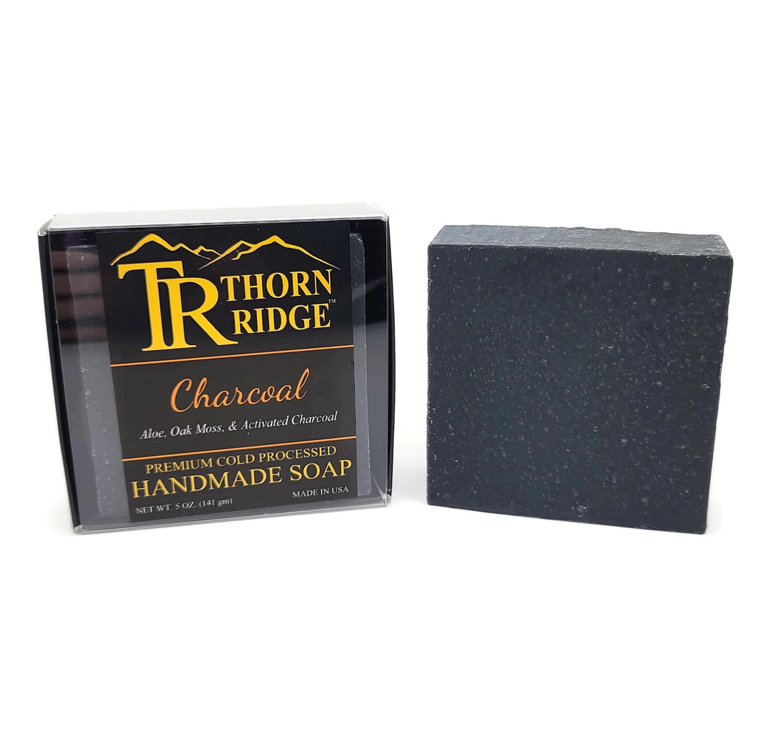 Packaging of Thorn Ridge soap labeled "Charcoal," described as aloe, oak moss, activated charcoal, premium cold processed, handmade, 5 oz. Made in USA.