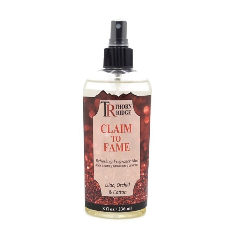 A bottle of Thorn Ridge fragrance mist labeled "Claim To Fame," described as a lilac, orchid, and cotton scent for body, home, bathroom, and vehicles. 8 fl oz.