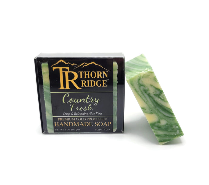 Packaging of Thorn Ridge soap labeled "Country Fresh," described as crisp and refreshing aloe vera, premium cold processed, handmade, 5 oz. Made in USA.