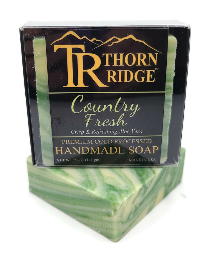 Packaging of Thorn Ridge soap labeled "Country Fresh," described as crisp and refreshing aloe vera, premium cold processed, handmade, 5 oz. Made in USA.