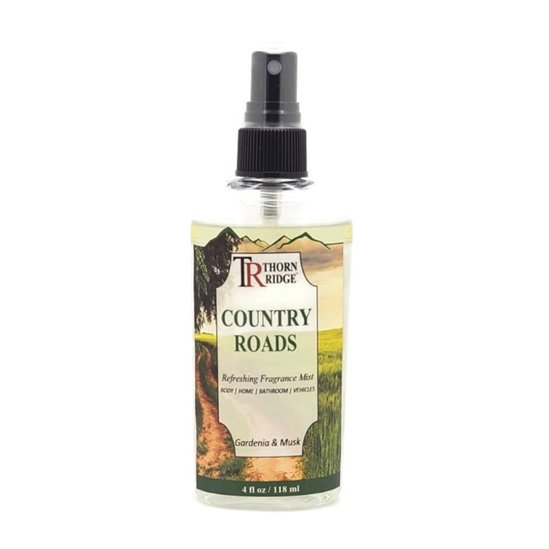 A bottle of Thorn Ridge fragrance mist labeled "Country Roads," described as a gardenia and musk  scent for body, home, bathroom, and vehicles. 4 fl oz.