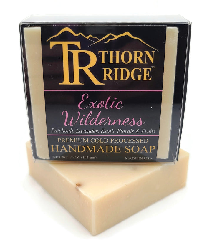 Packaging of Thorn Ridge soap labeled "Exotic Wilderness," described as patchouli, lavender, exotic florals and fruits, premium cold processed, handmade, 5 oz. Made in USA.