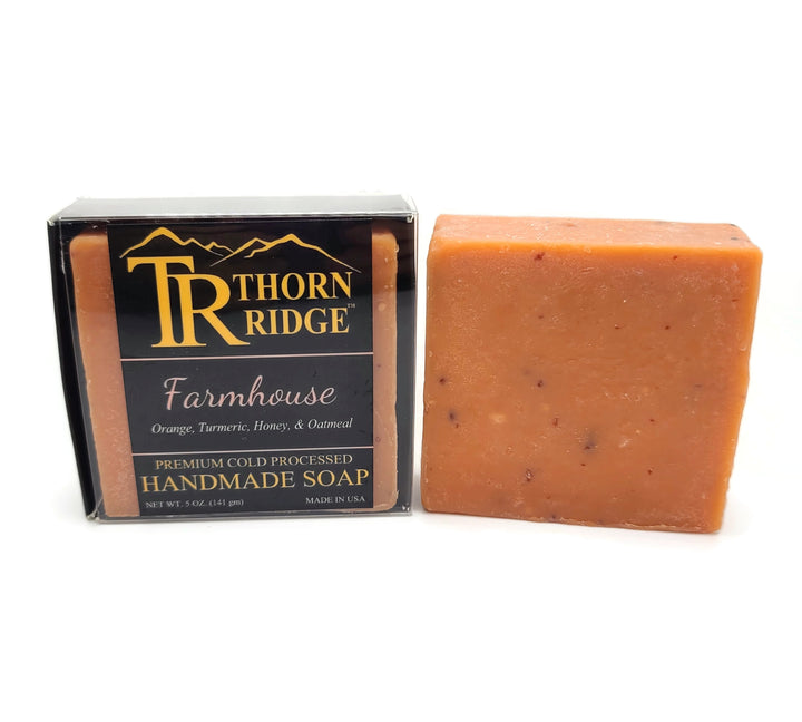 Packaging of Thorn Ridge soap labeled "Farmhouse," described as orange, turmeric, honey, oatmeal, premium cold processed, handmade, 5 oz. Made in USA.