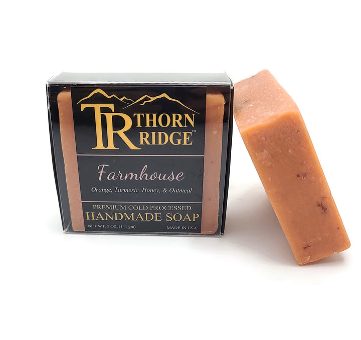 Packaging of Thorn Ridge soap labeled "Farmhouse," described as orange, turmeric, honey, oatmeal, premium cold processed, handmade, 5 oz. Made in USA.