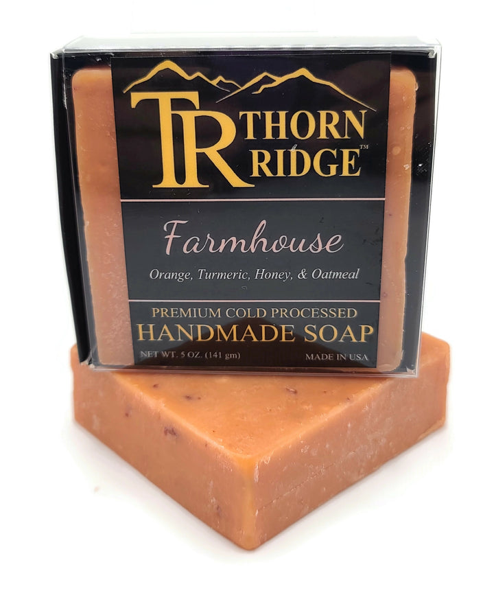 Packaging of Thorn Ridge soap labeled "Farmhouse," described as orange, turmeric, honey, oatmeal, premium cold processed, handmade, 5 oz. Made in USA.