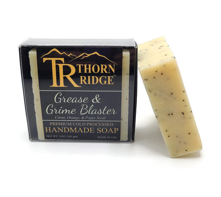 Packaging of Thorn Ridge soap labeled "Grease and Grime Blaster," described as citrus, orange, poppy seeds, premium cold processed, handmade, 5 oz. Made in USA.