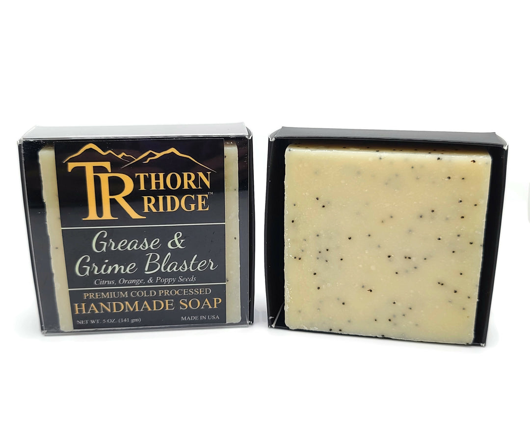 Packaging of Thorn Ridge soap labeled "Grease and Grime Blaster," described as citrus, orange, poppy seeds, premium cold processed, handmade, 5 oz. Made in USA.