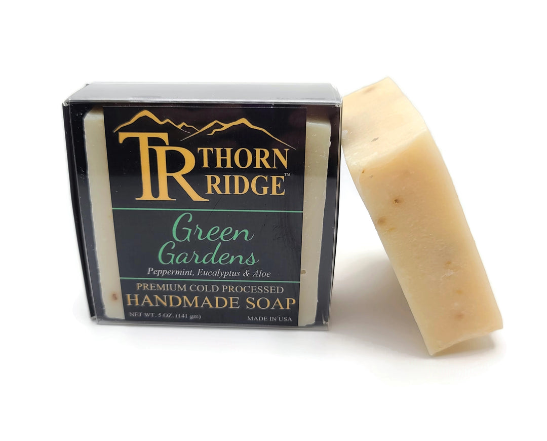 Packaging of Thorn Ridge soap labeled "Green Gardens," described as peppermint, eucalyptus, aloe, premium cold processed, handmade, 5 oz. Made in USA.