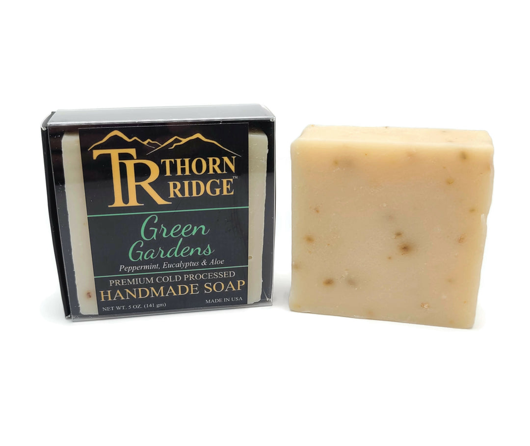 Packaging of Thorn Ridge soap labeled "Green Gardens," described as peppermint, eucalyptus, aloe, premium cold processed, handmade, 5 oz. Made in USA.